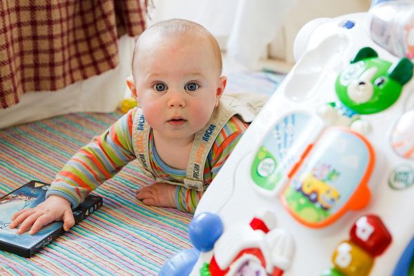 Infant with toy