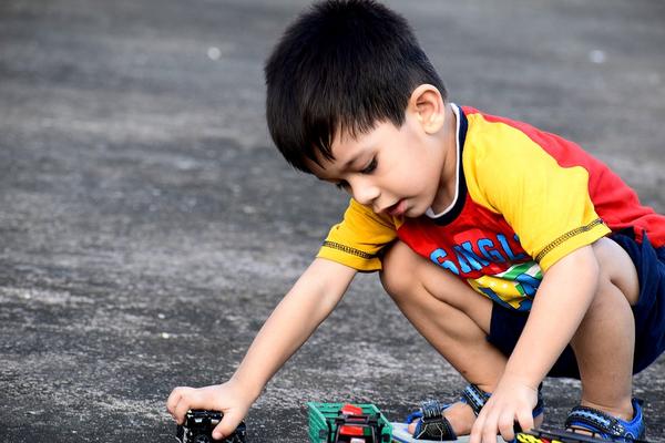 Kid playing with car