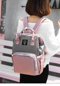 Pink and Grey Diaper Backpack on Shoulder